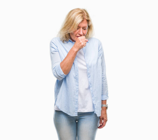 Middle age blonde woman over isolated background feeling unwell and coughing as symptom for cold or bronchitis. Healthcare concept.