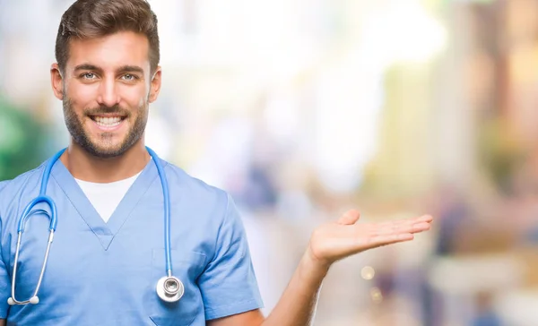 Young Handsome Doctor Surgeon Man Isolated Background Smiling Cheerful Presenting — Stock Photo, Image