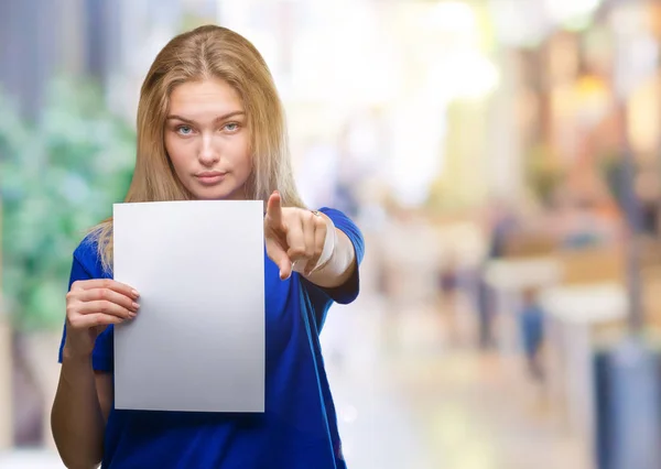 Young Caucasian Woman Holding Blank Paper Sheet Isolated Background Pointing — Stock Photo, Image
