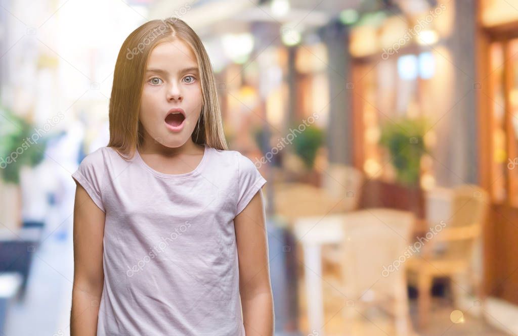 Young beautiful girl over isolated background afraid and shocked with surprise expression, fear and excited face.