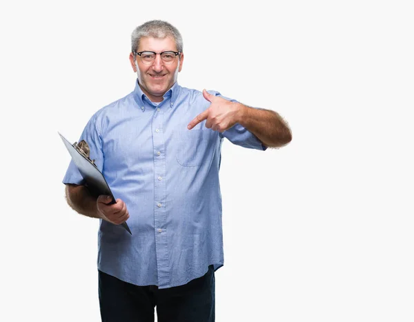 Handsome Senior Inspector Man Holding Clipboard Isolated Background Surprise Face — Stock Photo, Image