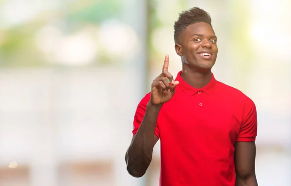 Junger Afrikanisch Amerikanischer Mann Mit Isoliertem Hintergrund Mit Erhobenem Zeigefinger — Stockfoto