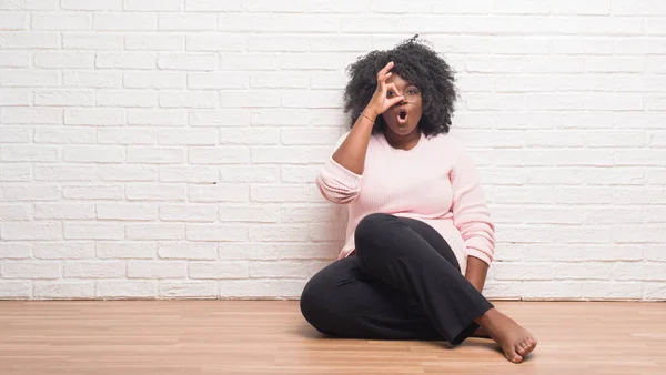 Young African American Woman Sitting Floor Home Doing Gesture Shocked — Stock Photo, Image
