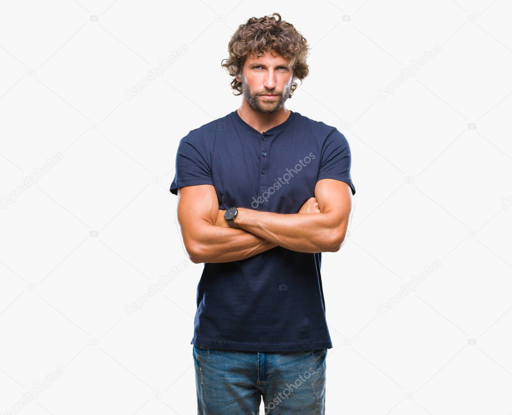 Handsome hispanic model man over isolated background skeptic and nervous, disapproving expression on face with crossed arms. Negative person.