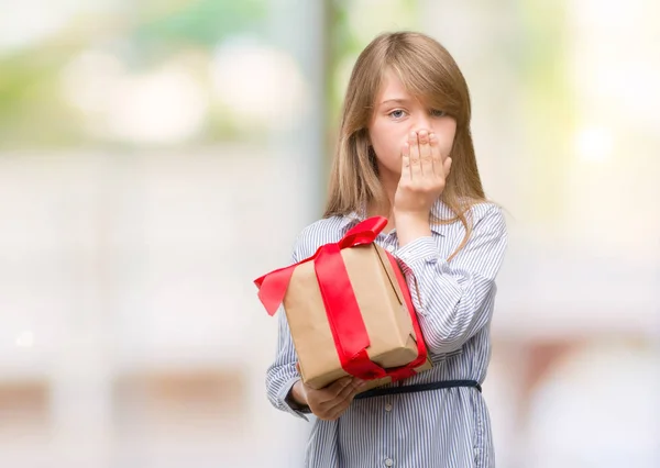 Young Blonde Toddler Holding Present Cover Mouth Hand Shocked Shame — Stock Photo, Image