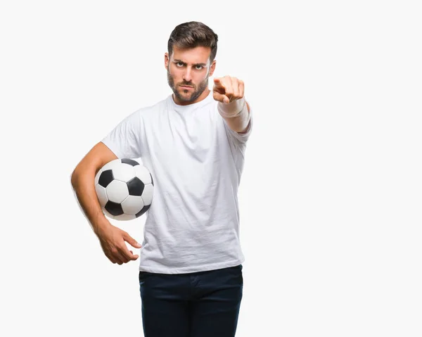 Młody Przystojny Mężczyzna Trzymając Piłki Nożnej Białym Tle Wskazując Palcem — Zdjęcie stockowe