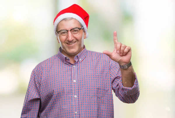 Hombre Mayor Guapo Con Sombrero Navidad Sobre Fondo Aislado Apuntando — Foto de Stock