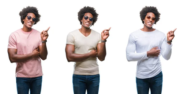非洲裔美国年轻人戴着太阳镜 脸上带着灿烂的笑容 用手和手指指着旁边看着镜头 — 图库照片