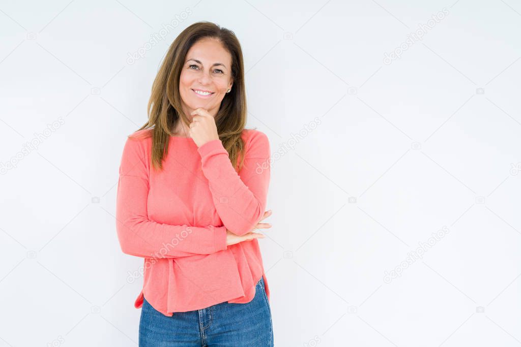 Beautiful middle age woman over isolated background looking confident at the camera with smile with crossed arms and hand raised on chin. Thinking positive.