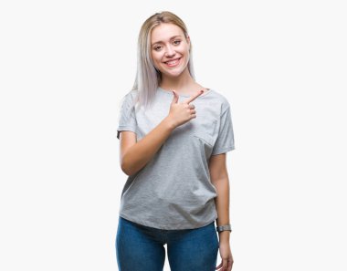 Sarışın genç kadın izole arka neşeli bir gülümseme ile el ve parmak kadar kameraya bakarak yüzündeki mutlu ve doğal ifade ile yan ile işaret yüz üzerinden.