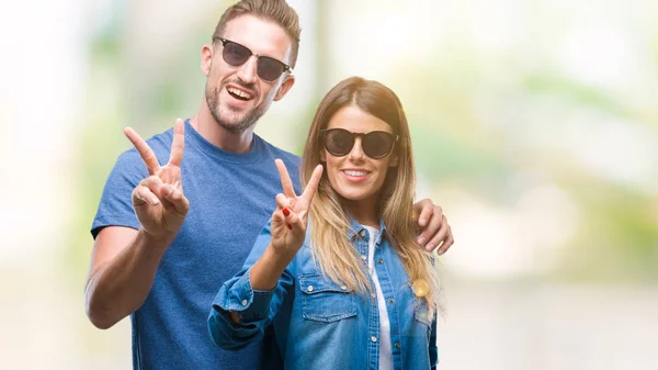 Young Couple Love Wearing Sunglasses Isolated Background Smiling Happy Face — Stock Photo, Image