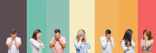 Collage of different ethnics young people over colorful stripes isolated background with sad expression covering face with hands while crying. Depression concept.