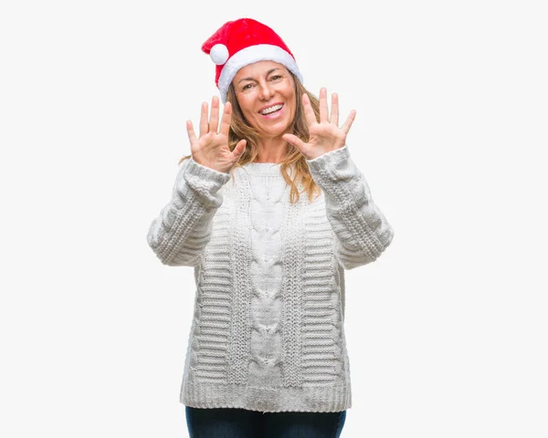 Middelbare Leeftijd Senior Spaanse Vrouw Dragen Kerstmuts Geïsoleerde Achtergrond Weergeven — Stockfoto