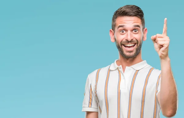 Jovem Homem Bonito Sobre Fundo Isolado Apontando Dedo Para Cima — Fotografia de Stock