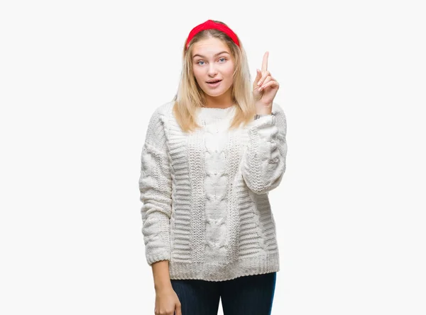 若い白人女性分離背景成功したアイデアと指を上向きに着て冬のセーター 終了したと満足しています ナンバーワン — ストック写真