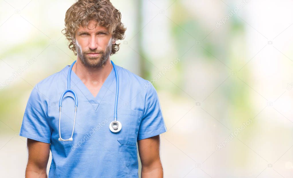 Handsome hispanic surgeon doctor man over isolated background skeptic and nervous, frowning upset because of problem. Negative person.