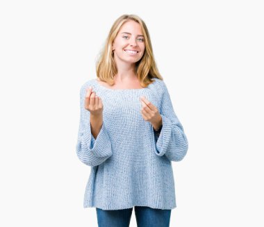 Maaş ödeme için milyoner iş soran izole arka plan yapıyor para hareketi el ile üzerinden mavi kazak giyen güzel genç kadın