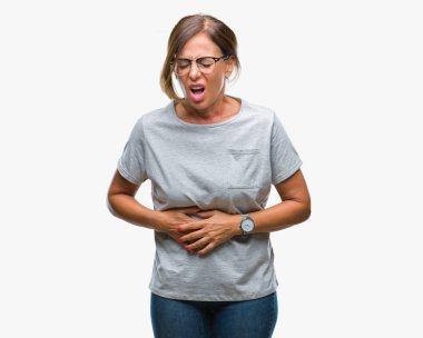 Üzerinde gözlük takan orta yaş İspanyol kadın kıdemli izole mide üzerinde el ile arka plan çünkü hazımsızlık, ağrılı hastalık hasta hissediyor. Ağrısı kavramı.