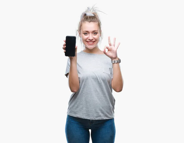 Mulher Loira Jovem Mostrando Tela Smartphone Sobre Fundo Isolado Fazendo — Fotografia de Stock