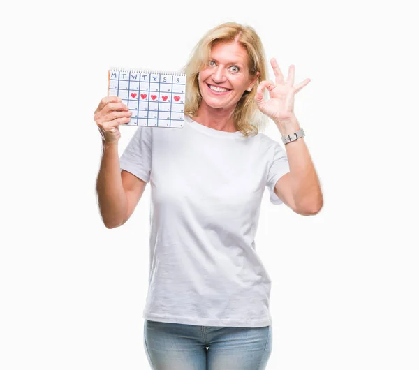 Mulher Loira Meia Idade Segurando Calendário Menstruação Ver Fundo Isolado — Fotografia de Stock