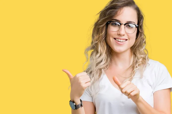 Beautiful Young Blonde Woman Wearing Glasses Isolated Background Pointing Back — Stock Photo, Image
