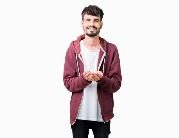 Joven Hombre Guapo Sobre Fondo Aislado Sonriendo Con Las Palmas — Foto de Stock