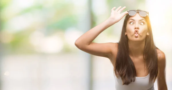 Young Beautiful Hispanic Wearing Sunglasses Making Fish Face Lips Crazy — Stock Photo, Image