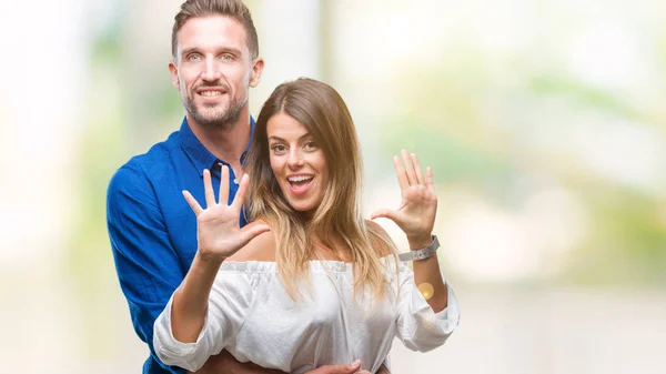 Young Couple Love Isolated Background Showing Pointing Fingers Number Ten — Stock Photo, Image