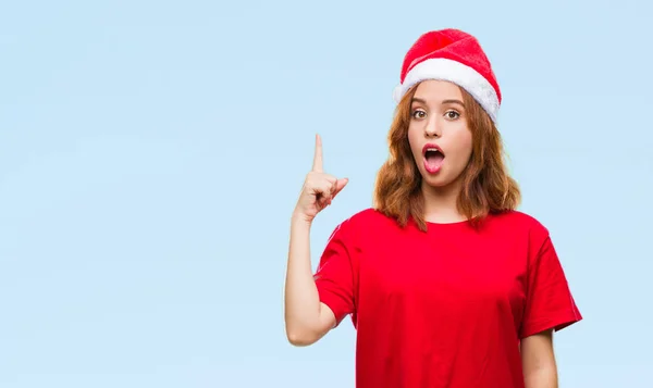 Jovem Bela Mulher Sobre Fundo Isolado Vestindo Chapéu Natal Apontando — Fotografia de Stock