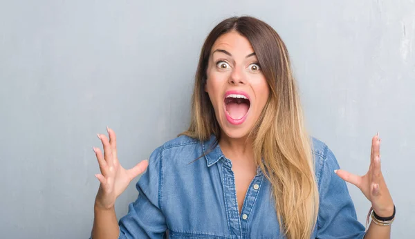 Young Adult Woman Grunge Grey Wall Wearing Denim Outfit Celebrating — Stock Photo, Image