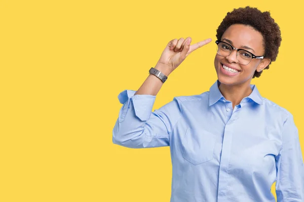 Young beautiful african american business woman over isolated background Smiling pointing to head with one finger, great idea or thought, good memory