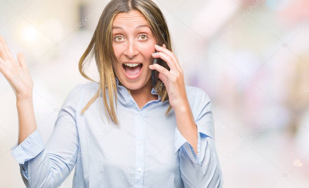 Young beautiful woman talking on smartphone over isolated background very happy and excited, winner expression celebrating victory screaming with big smile and raised hands