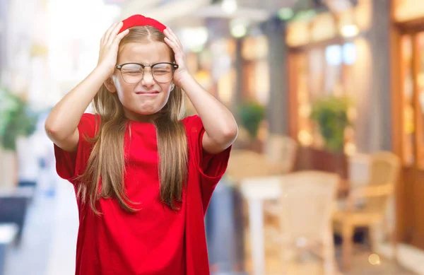 Young beautiful girl wearing glasses over isolated background suffering from headache desperate and stressed because pain and migraine. Hands on head.