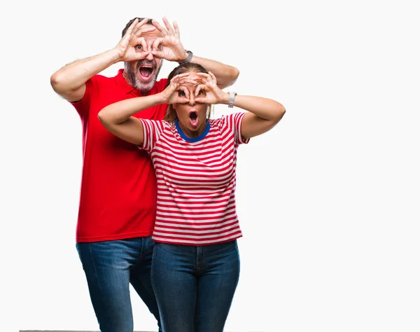 Middle Age Hispanic Couple Love Isolated Background Doing Gesture Binoculars — Stock Photo, Image