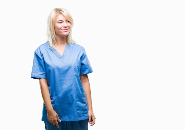 Young Beautiful Blonde Nurse Doctor Woman Isolated Background Looking Away — Stock Photo, Image