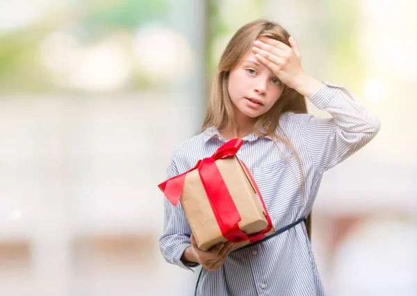 Young Blonde Toddler Holding Present Stressed Hand Head Shocked Shame — Stock Photo, Image