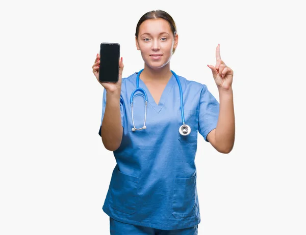 Young Caucasian Doctor Woman Showing Smarpthone Isolated Background Surprised Idea — Stock Photo, Image