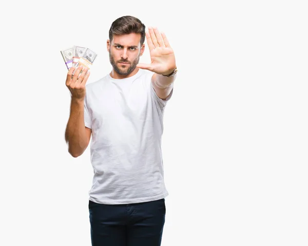 Junger Gutaussehender Mann Mit Einem Stapel Dollars Vor Isoliertem Hintergrund — Stockfoto