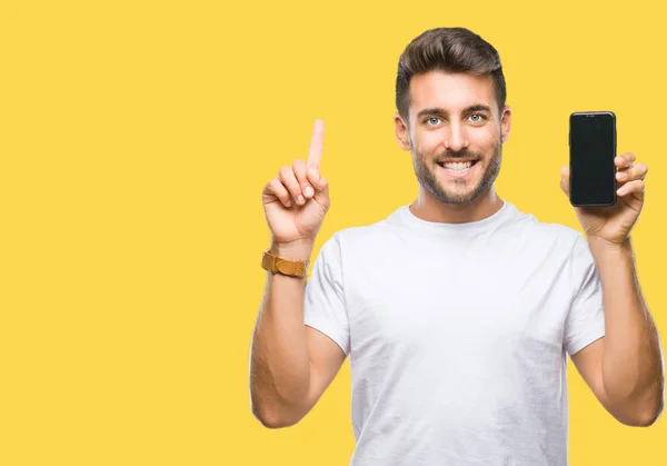 Young Handsome Man Showing Smartphone Screen Isolated Background Surprised Idea — Stock Photo, Image