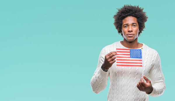 Afro american man flag of United States of America over isolated background with a confident expression on smart face thinking serious