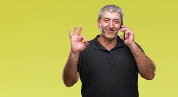 Handsome Senior Man Talking Smartphone Isolated Background Doing Sign Fingers — Stock Photo, Image