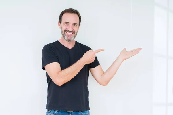 Senior Man Isolated Background Amazed Smiling Camera While Presenting Hand — Stock Photo, Image