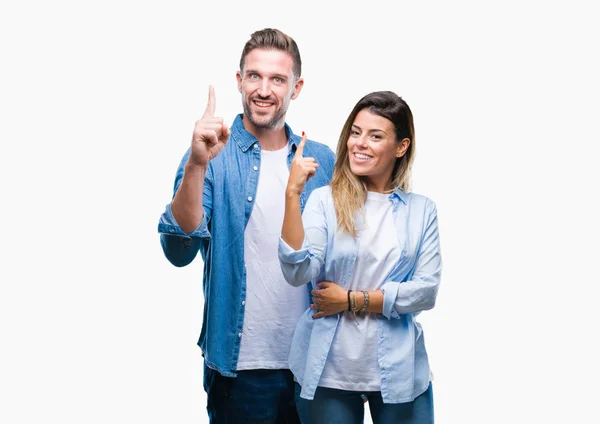 Casal Jovem Apaixonado Por Fundo Isolado Apontando Dedo Para Cima — Fotografia de Stock