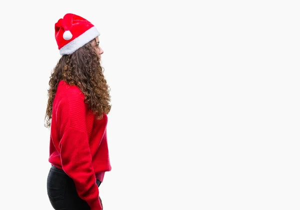 Giovane Ragazza Bruna Indossa Cappello Natale Sfondo Isolato Cercando Lato — Foto Stock
