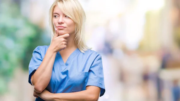 Young Beautiful Blonde Nurse Doctor Woman Isolated Background Hand Chin — Stock Photo, Image