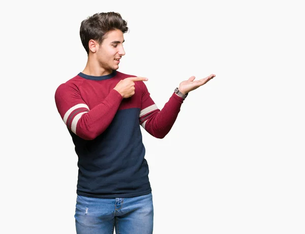 Young Handsome Man Isolated Background Amazed Smiling Camera While Presenting — Stock Photo, Image