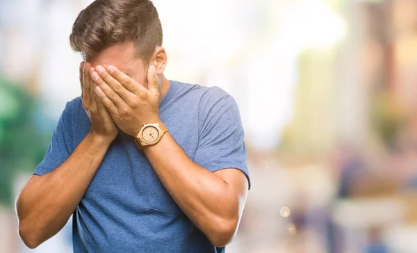 Jovem Homem Bonito Sobre Fundo Isolado Com Expressão Triste Cobrindo — Fotografia de Stock