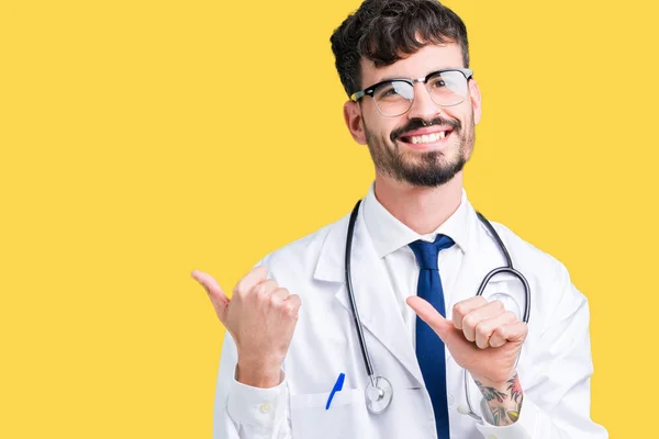 Young Doctor Man Wearing Hospital Coat Isolated Background Pointing Back — Stock Photo, Image