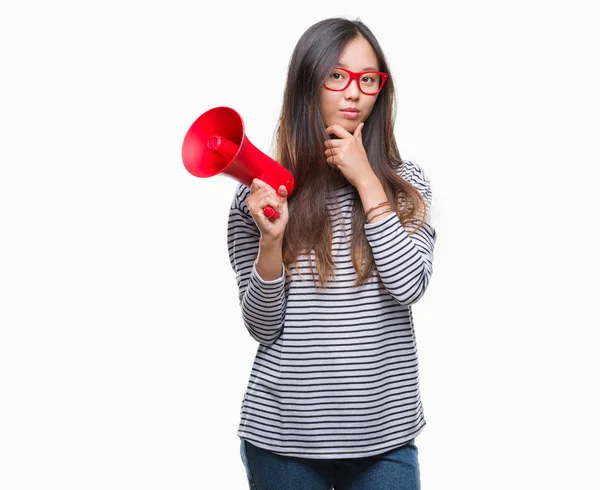 Young Asian Woman Holding Megaphone Isolated Background Serious Face Thinking — Stock Photo, Image