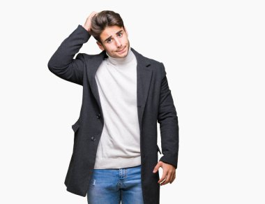 Zarif delikanlı giyen kış ceket izole arka plan üzerinde yanıltır ve soru hakkında merak ediyorum. Şüphe, kafasına el ile düşünme ile belirsiz. Dalgın kavramı.